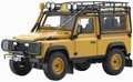 Land Rover Defender 90 Geel - Yellow + accessoires 1/18